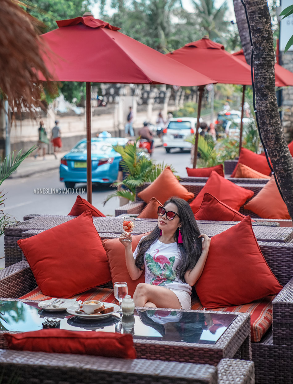 Girl having breakfast at Kuta Beach, Bali at Kuta Seaview Boutique Resort